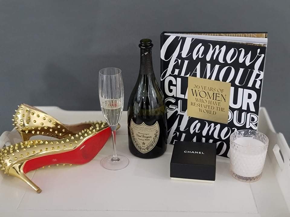 champagne, heels, book